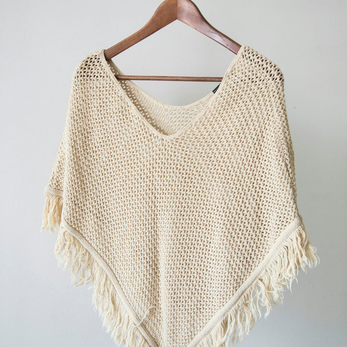 white v neck shirt on brown clothes hanger