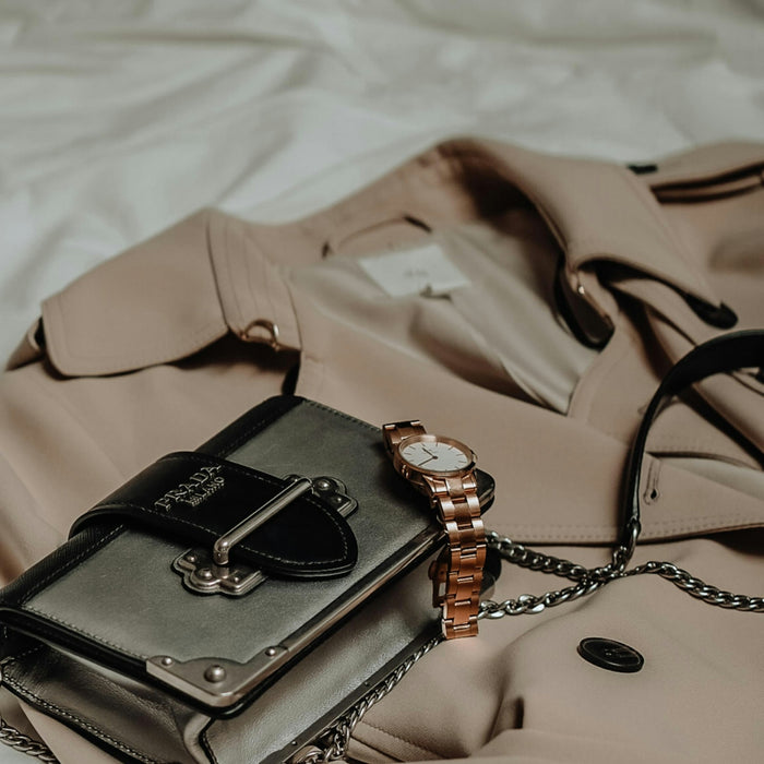 brown leather sling bag on white textile