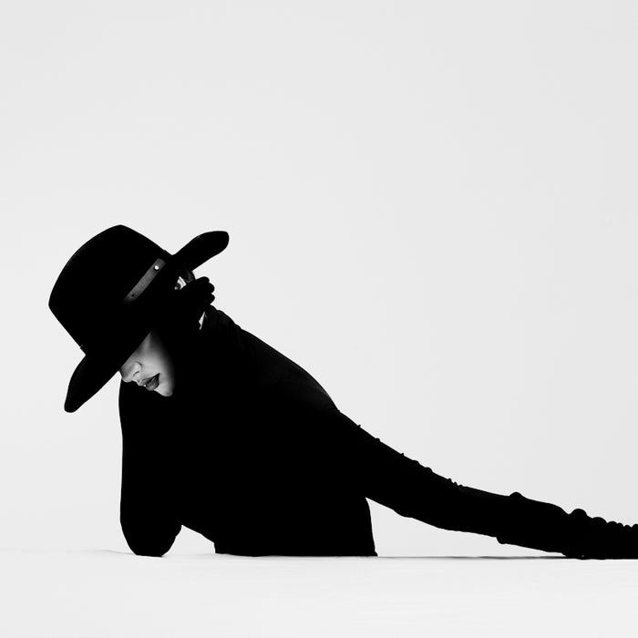 silhouette of a person wearing cowboy hat