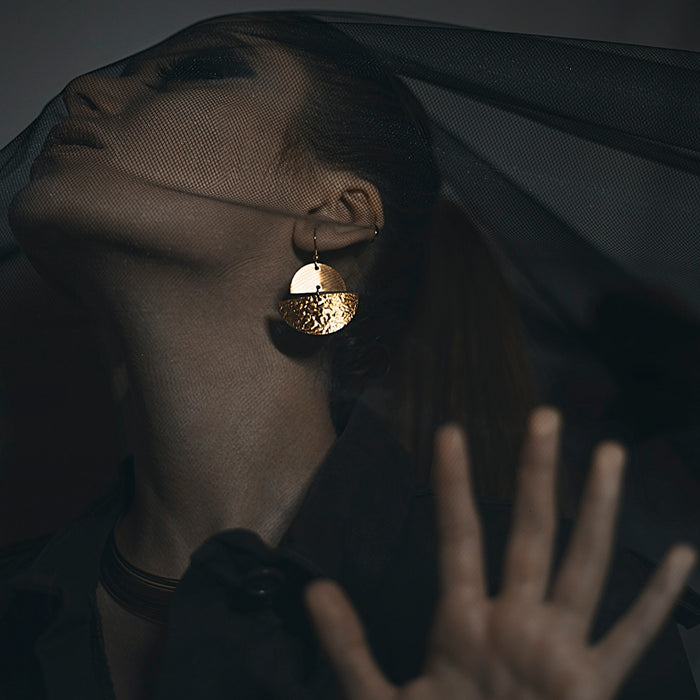 person wearing gold and silver ring