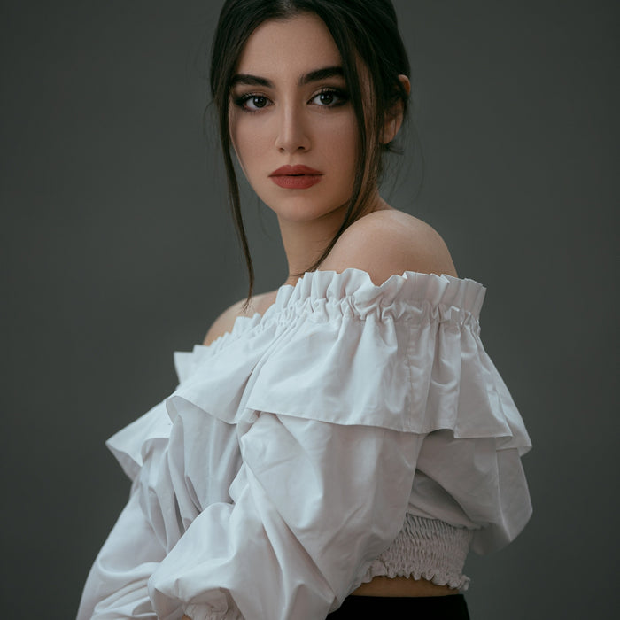 woman in white off shoulder dress