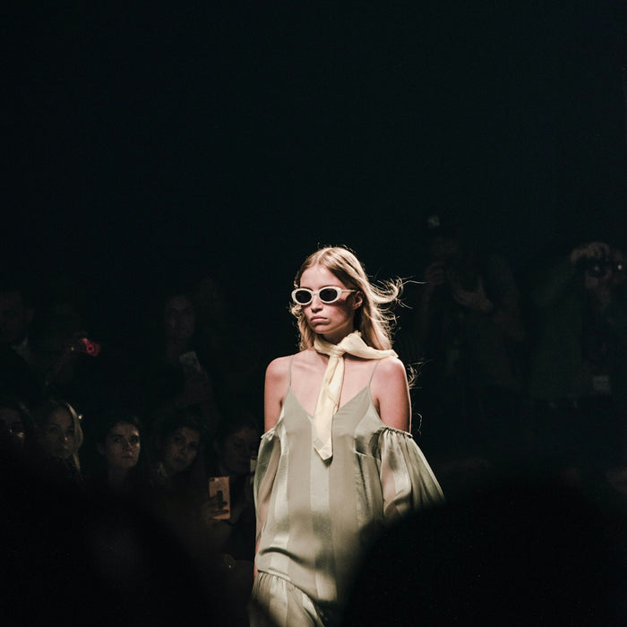 woman in white dress wearing sunglasses