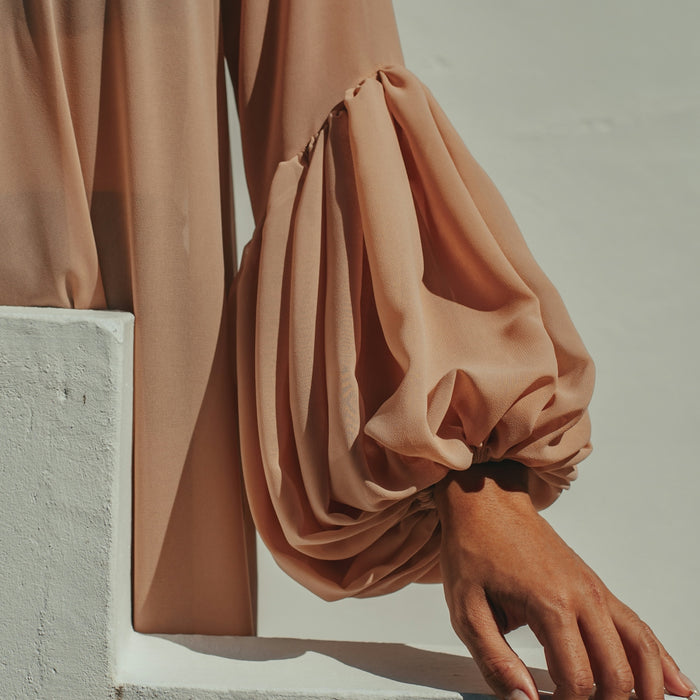 person in brown long sleeve shirt