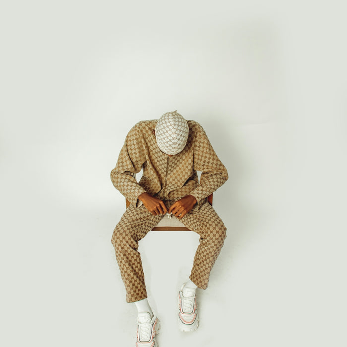 A man in a suit sitting on a bench