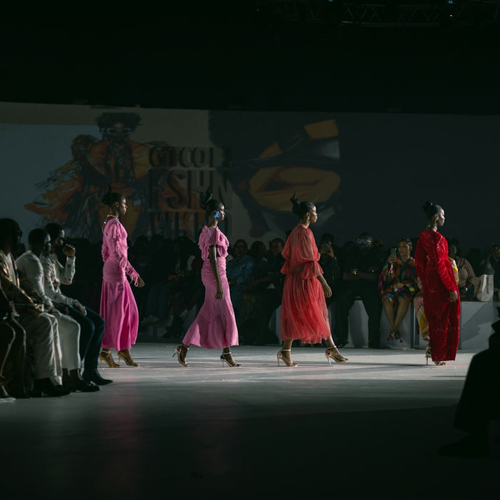 A group of women walking down a runway