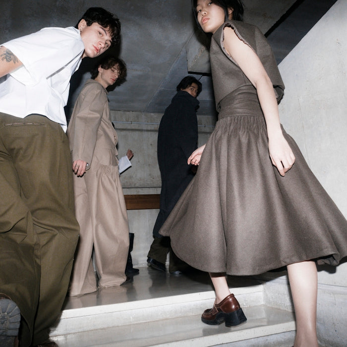 People are descending a staircase together.