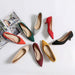 Colorful high-heeled shoes on a white surface with a magazine in the background.