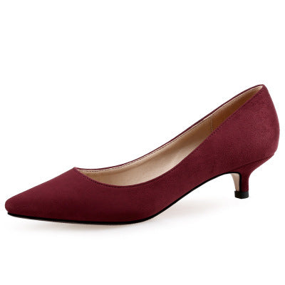 Maroon high heel shoe on a white background