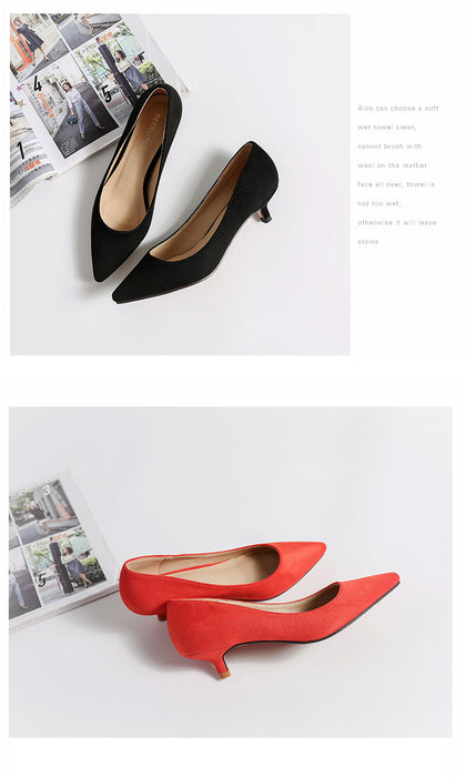 Black and red high-heeled shoes on a white background with a magazine.