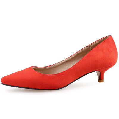Red high-heeled shoe on a white background