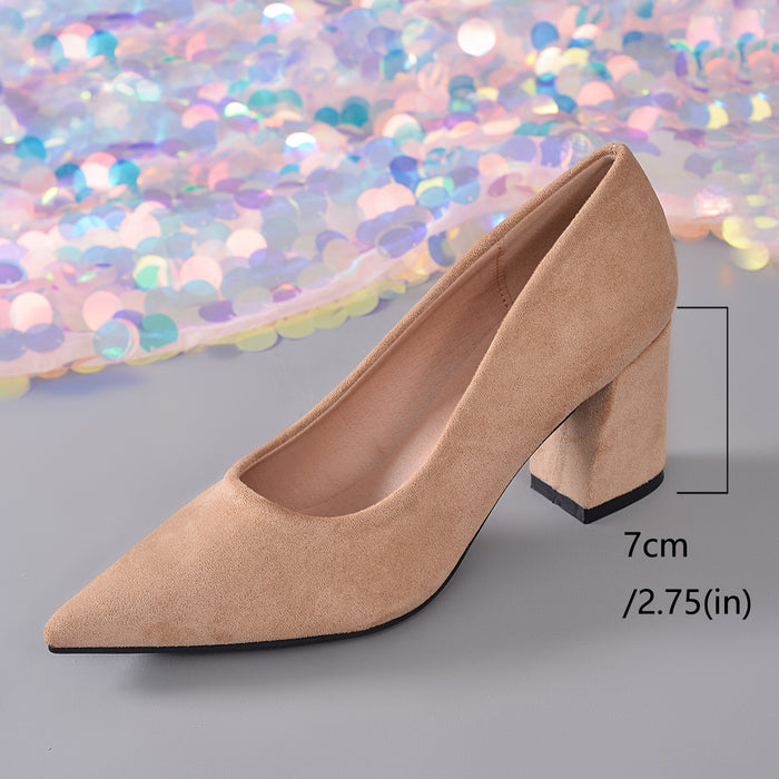 A beige pointed-toe pump with a chunky block heel, shown on a gray surface with a background of iridescent sequins. A measurement overlay indicates the heel height is 7cm (2.