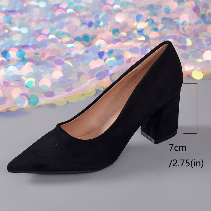 A single black pointed-toe high heel shoe shown on a gray surface with a colorful sequin backdrop. A measurement overlay indicates the heel height as 7cm (2.