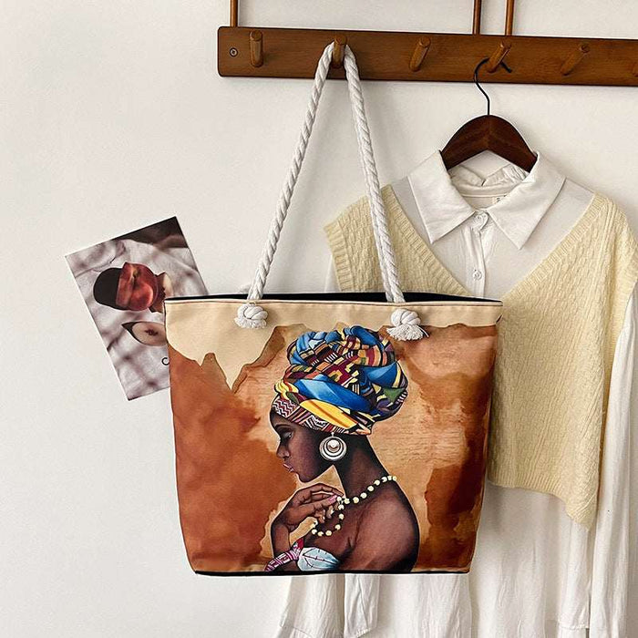 Tote bag with a design of a woman with a colorful headscarf hanging on a coat rack.