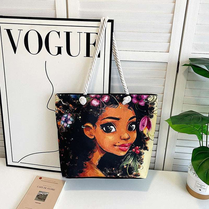 Tote bag with a colorful design of a woman's face on a white surface with a 'Vogue' magazine in the background.