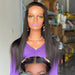 Mannequin head with long black hair and purple top in a store setting