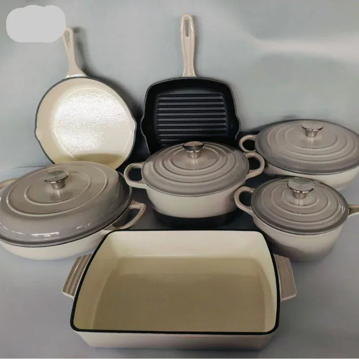 Set of ceramic cookware with lids on a gray background
