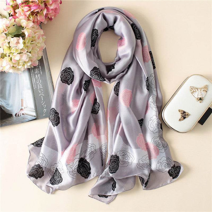 Gray scarf with floral patterns on a light background