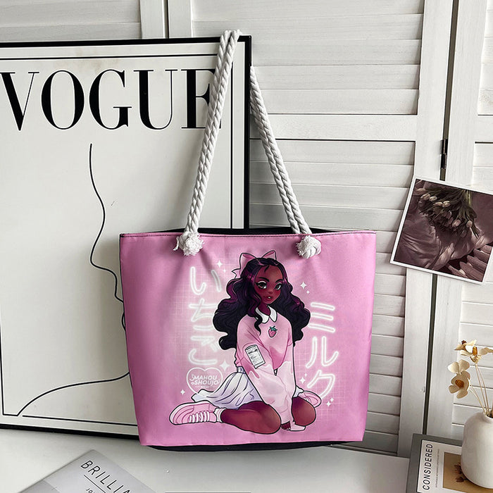Pink tote bag with a character design on a surface with a 'Vogue' magazine in the background.