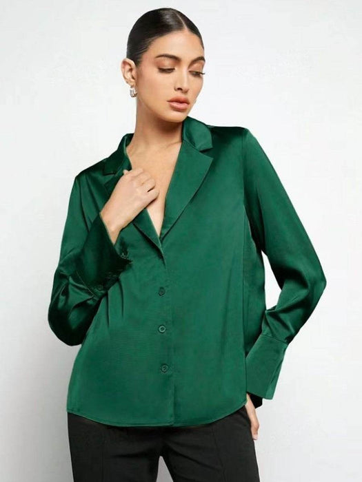 Woman wearing a green blouse against a white background