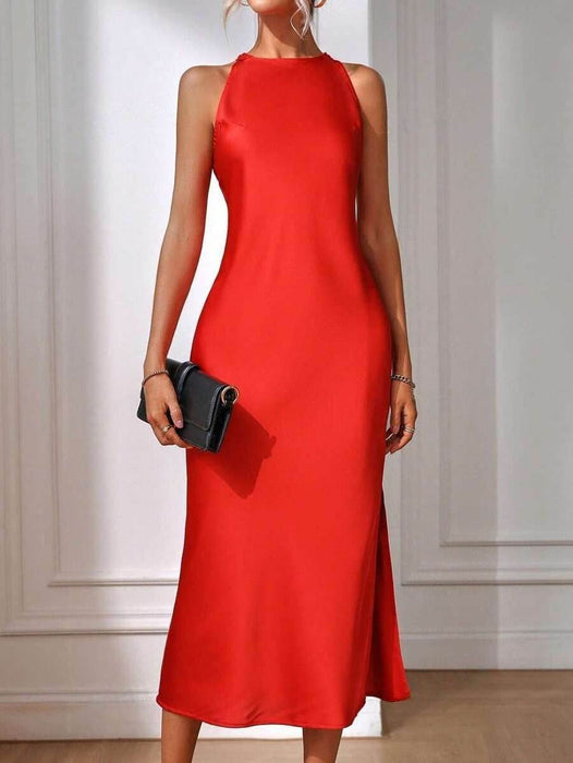 Red dress with a black clutch against a neutral background