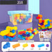 Multicolor children's building blocks set in a clear storage bin with assembled toy models, shown on a purple background with accessory counts and a sticker sheet inset.