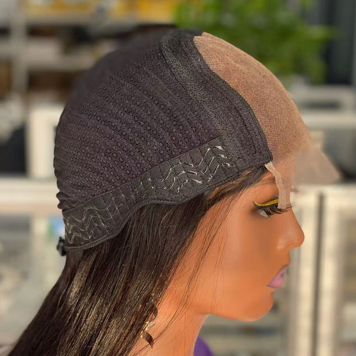 Mannequin head with a wig on display, showing the lace front and side view.