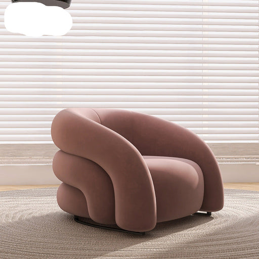 Pink armchair in a room with light-colored blinds