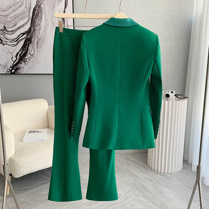Green suit on a hanger against a neutral background