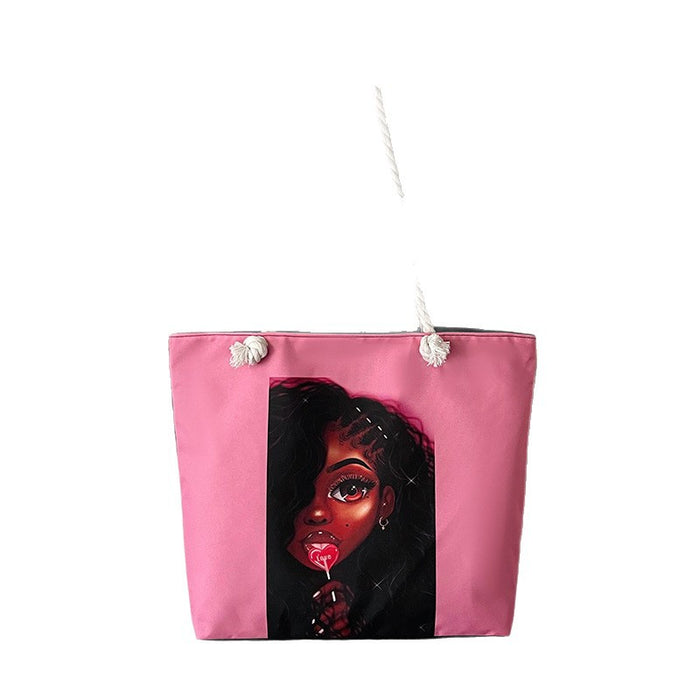 Pink tote bag with a graphic of a woman's face on a white background