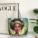 Tote bag with a design of a woman's face on a magazine with 'VOGUE' branding.