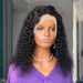 Mannequin head with a black curly wig and purple top, wearing yellow makeup.