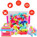 A colorful children's building block set shown with a clear plastic storage bin filled with multicolored bricks and several assembled toy structures in front. Red circular callout icons with Chinese text surround the product, explaining developmental benefits.