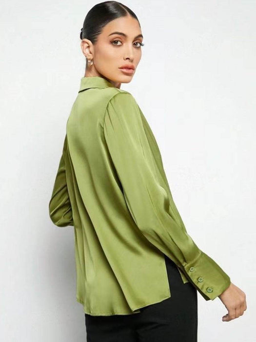 Woman wearing a green blouse against a white background