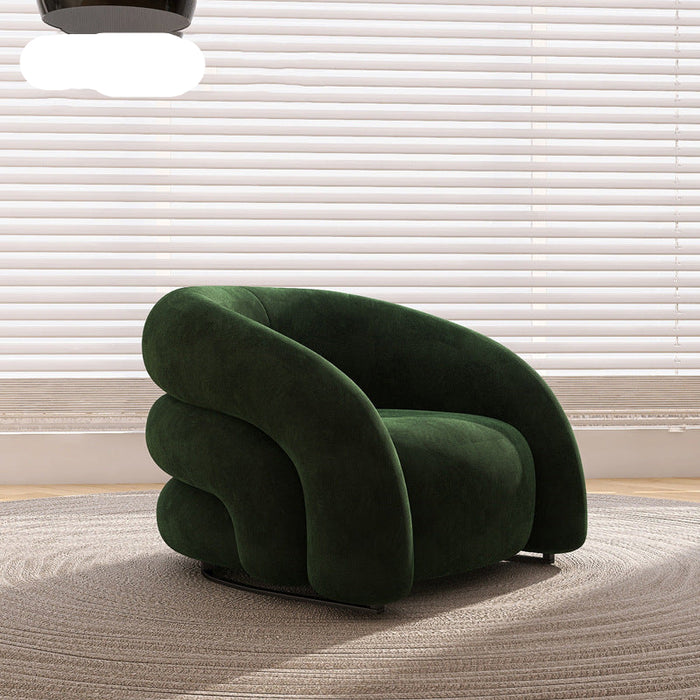 Green armchair in a room with light-colored blinds and carpet.