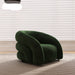 Green armchair in a room with light-colored blinds and carpet.
