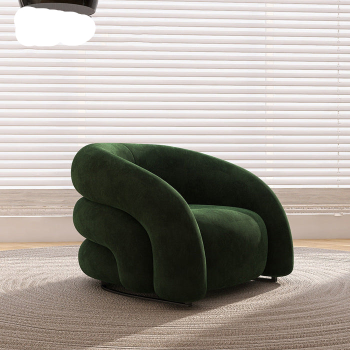 Green armchair in a room with light-colored blinds and carpet.