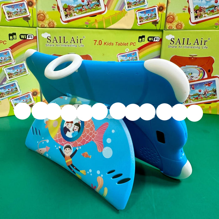 A blue shark-shaped tablet stand holding a tablet, with colorful SAIL Air 7.0 Kids Tablet PC retail boxes stacked behind it on a green surface.