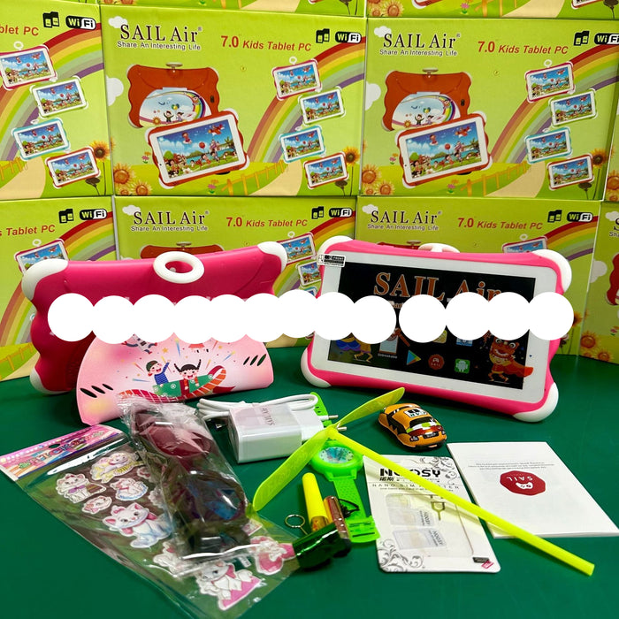 SAIL Air 7.0 Kids Tablet PC with a pink protective case, shown alongside its green retail packaging boxes, accessories including a green toy propeller, a small yellow toy car, stickers, and a pen, arranged on a green surface.