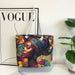 Colorful tote bag with a design of a woman wearing a headscarf on a white surface with a 'Vogue' magazine.