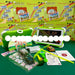 A children's tablet learning kit displayed on a green surface with multiple SAIL Air 7.0 Kids Tablet PC retail boxes in the background.