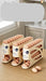 Three beige egg storage racks filled with brown eggs on a wooden countertop in a kitchen setting.