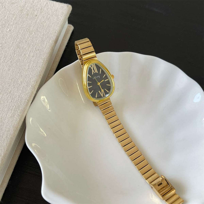 Gold watch on a white dish with a black background