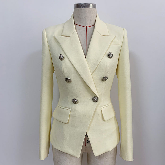 Cream-colored blazer with silver buttons on a mannequin against a plain background