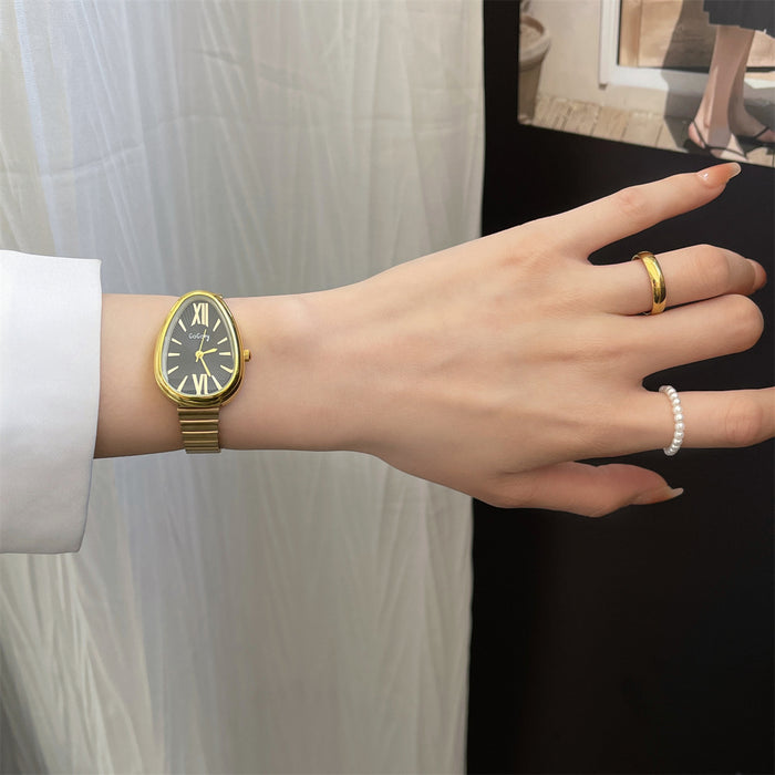 Hand wearing a gold watch with a white background