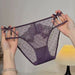 A pair of sheer purple lace and mesh panties with bow details on the sides, held up by two hands against a softly lit indoor background.