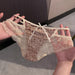 A pair of women's lace panties with a leopard print pattern, held up by two hands. The underwear features a beige and brown leopard print base with cream-colored lace trim, side ruffles, and a small bow at the center front.
