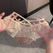 A pair of women's lace panties held up by two hands. The panties feature a cream-colored floral lace overlay with a brown leopard print lining visible underneath.
