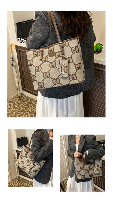 A beige and brown monogram tote bag with a double-G pattern, shown worn over the shoulder by a person in a gray blazer and white skirt in an indoor setting. Three views are shown in a collage.