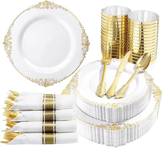 Gold and white party supplies including plates, cups, and cutlery on a white background.