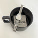 Silver watch with a Chanel Paris tag inside a black mug on a white background
